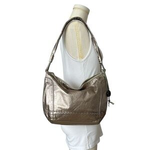 The Sak metallic leather shoulder bag hobo lightweight neutral bronze boho purse